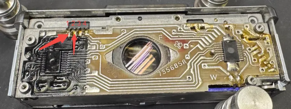 Figure 3-3 Flash test contacts on the original board: pins 1 and 2